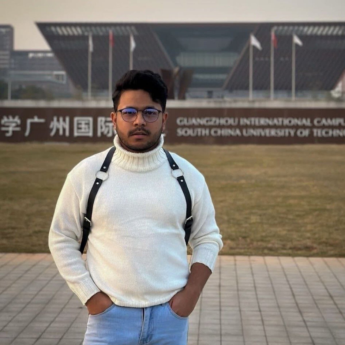 Hasnat Jani Rafin at a waterfront location in a beige shirt